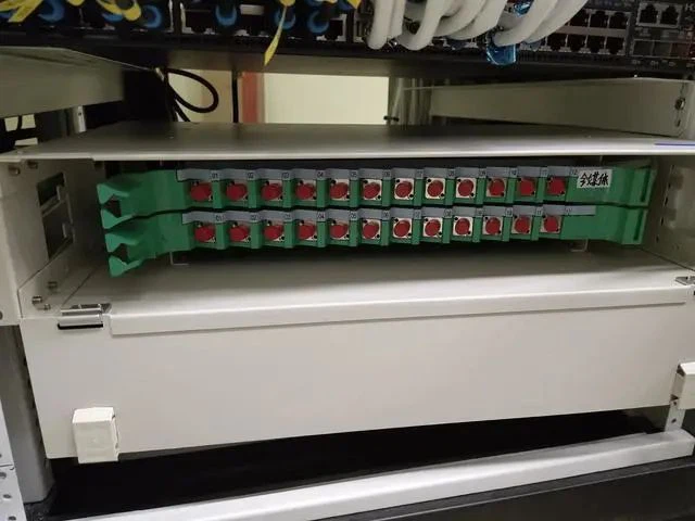 Put the fiber optic cable in the fiber tray. Put the fiber optic cable in the fiber tray.